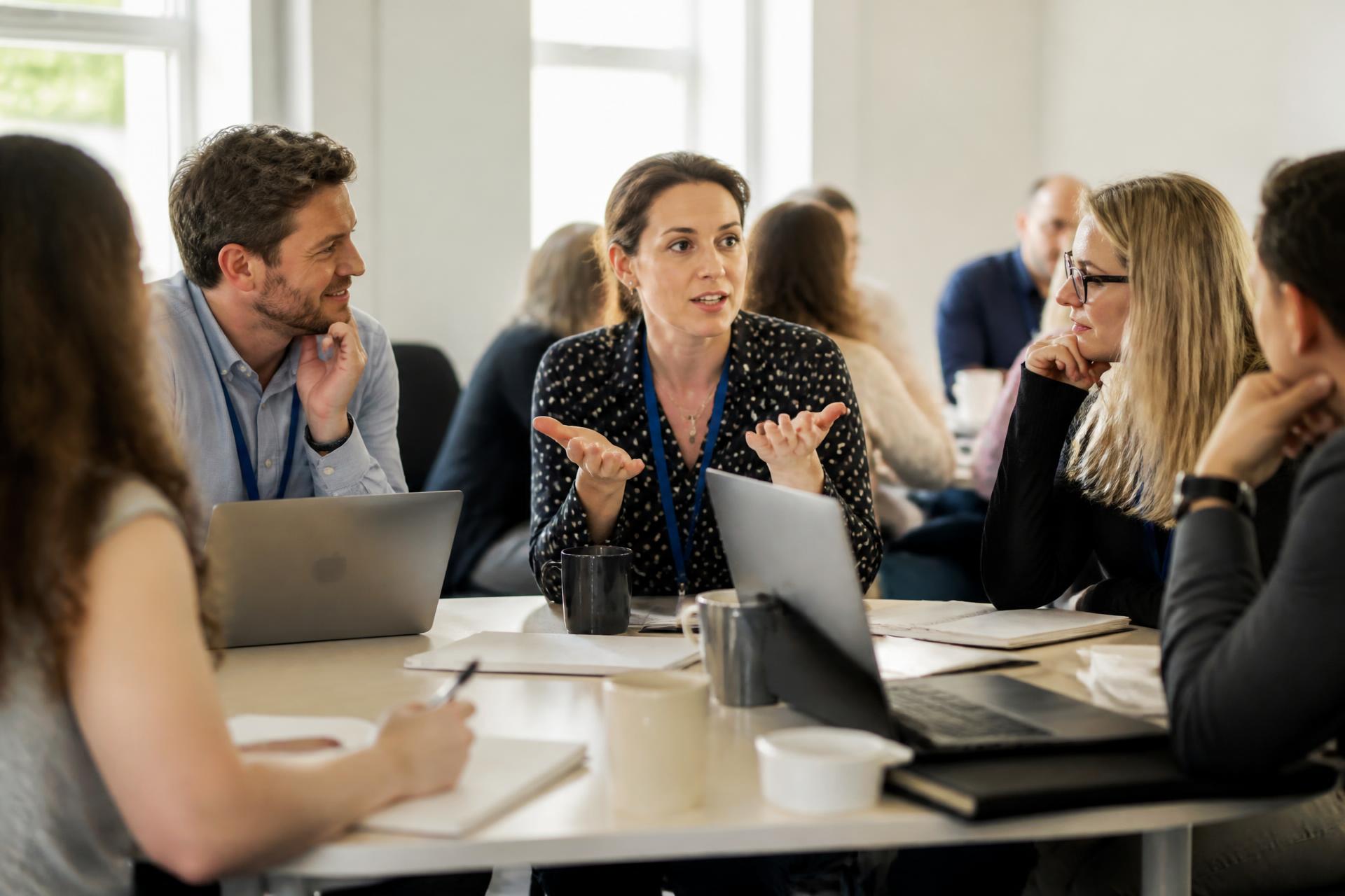 Teachers around a table in a CPD workshop